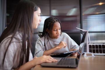 Group of international or multi ethnicity student having a discussion together about science...