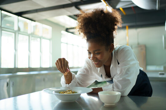 Happy African - Black Professional Chef Cooking In Kitchen In Restaurant.