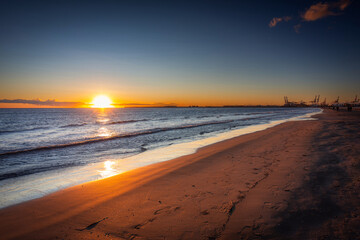 Fototapeta na wymiar Playa de las Arenas beach by the Mediterranean Sea in Valencia at sunrise. Spain