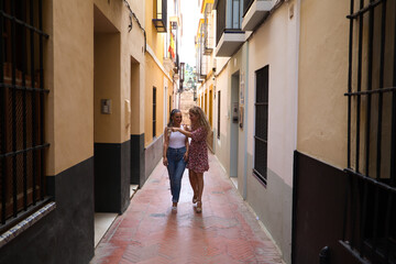 Obraz premium bride and groom walking on the street