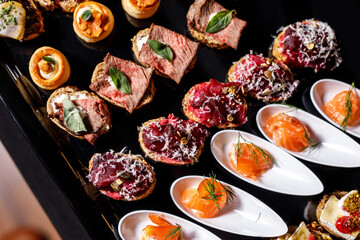 Catering plate. Assortment of snacks on the buffet table.