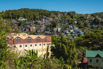 Baguio City, Philippines - Apartment buildings and multi-storey houses in the outer limits of the city. As seen from Kennon Road.
