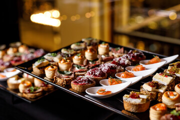 Catering plate. Assortment of snacks on the buffet table.