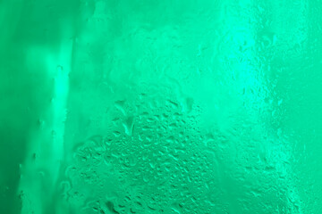 Drops of rain water droplets on glass