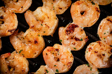 Delicious grilled shrimp. Macro background.