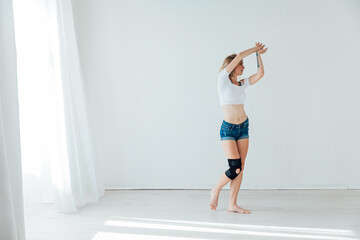 a woman dancing in a dance studio in a dance hall in a dance studio