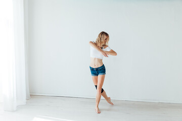 woman dancer dancing a beautiful dance in the dance hall of the dance studio in the dance studio