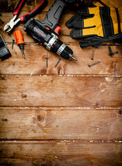 Working tool. Screwdriver with self-tapping screws on the table. 