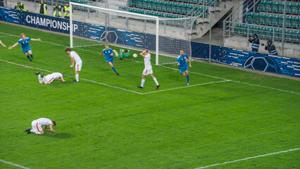 Championship Match: Blue Soccer Football Team Attack, Player Run Happy after Scoring Goal, Celebrate Victory, Hugging With Teammates. Sport Channel Broadcast Television Concept.