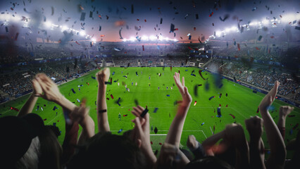 Establishing Shot of Fans Cheer for Their Team on a Stadium During Soccer Championship. Team Scores...