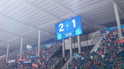 Football Soccer Stadium Championship Match, Scoreboard Screen Showing Score of 2:1. Crowd of Fans Cheering, Screaming, Having Fun. Sports Channel Television Broadcast or Advertising Concept