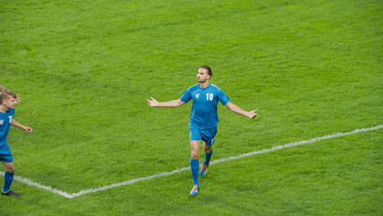Soccer Football Championship: Blue Team Forward Running Excited After Scoring a Goal in Finals....