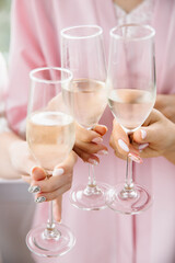 three glasses of champagne close-up in hands