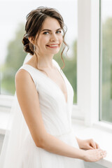 bride in bright interior smiling