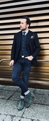 Handsome man in jacket and jeans.  - obrazy, fototapety, plakaty
