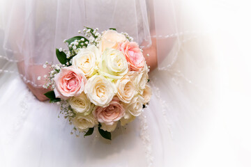 Beautiful bride in a wedding dress holding a bouquet of pink roses. White background. Text space.