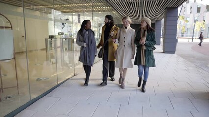 Group of coworkers walking outside in workplace discuss about business plan. High quality 4k footage