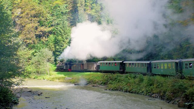 Coal Steam Train With Wagons Rides In The Mountains