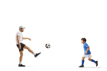 Fototapeta na wymiar SPorts coach playing football with a boy