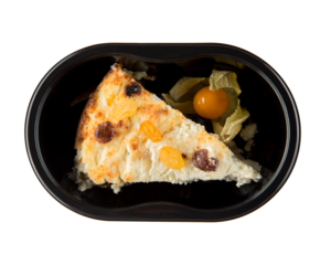 A dish in a black disposable container from catering on a concrete background, dietary catering, ready meals with you, healthy food