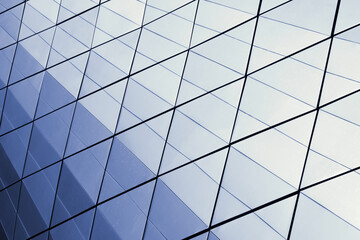 Fragment of a modern business building with a glass facade.