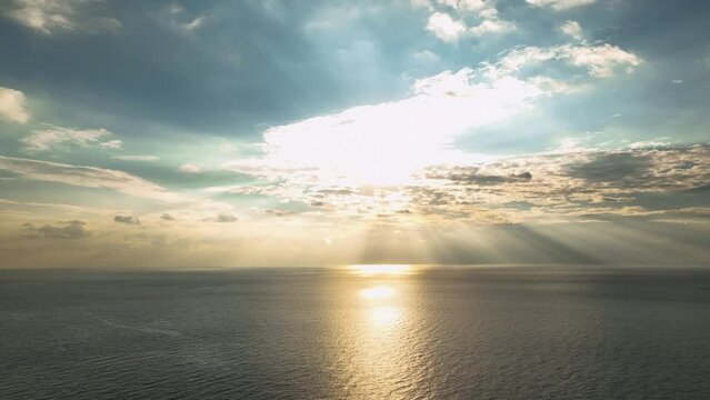 Blue Yellow sunset sea. Sundown over calm sea. Aerial view 4K