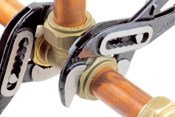 Plumbing wrenches adjusting fitting on pipework. transparent png.