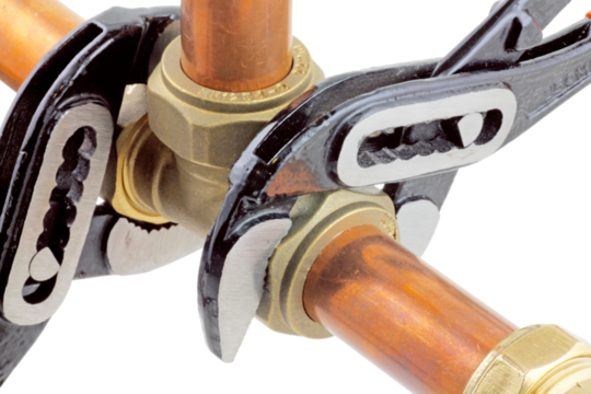Plumbing wrenches adjusting fitting on pipework. transparent png.