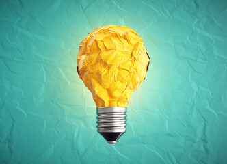 Creative idea and innovation. Crumpled paper as light bulb.
