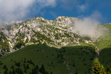 The rocky white massif of the Piatra Craiului mountain range in the Romanian Carpathians