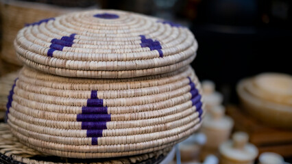 Decorative wicker basket, blurred background, with spaces