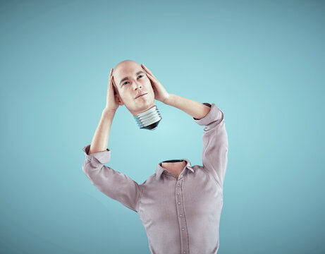 Man remove his head as a lightbulb. Brainstorm and creative concept.