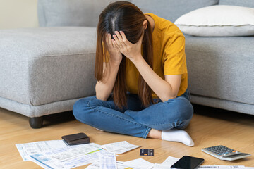 Financial owe asian woman sitting cover face with hands, stressed by calculate expense from invoice...