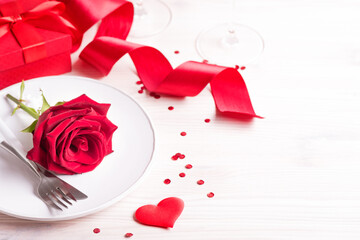 Fototapeta na wymiar Valentines day table setting with red rose