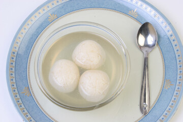 Indian Rasgulla or Rosogulla dessert/sweet served in a bowl. selective focus
