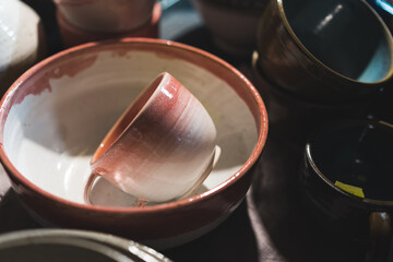 Handmade ceramics dinnerware set at handcraft market. High quality photo