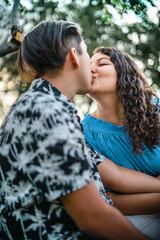 couple kissing in park