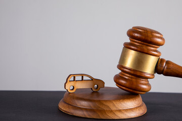 the judge's wooden gavel and wooden car