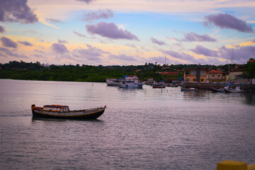 Fototapeta na wymiar boats at sunset