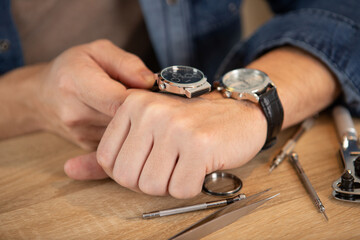 senior watchmaker repairing an old pocket watch