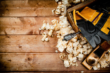 Hand planer with wooden sawdust. 