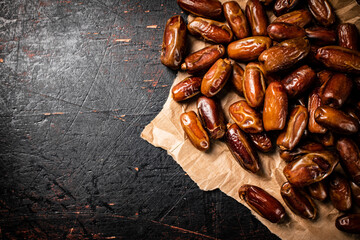 A pile of dates on paper on the table. 