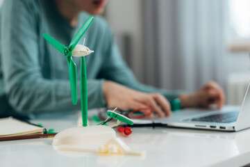 Close up view of a boy working on a school project