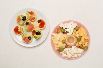 Different tasty snacks for party on wooden background, top view