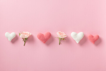 Valentine's Day background. Banner layout with roses and hearts on a light pink background with a space for text. Minimalism is love, romance.