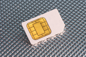 SIM-Card / SIM-Karte auf metallischem Hintergrund / Aluminium