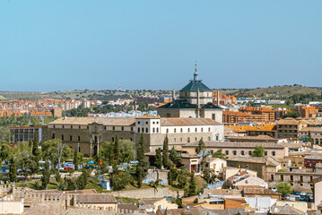 Fototapeta na wymiar Toledo, España. April 29, 2022: Tavera Hospital and panoramic landscape with blue sky.