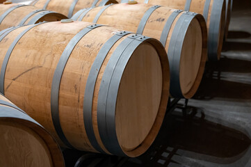 Rows of french and american oak barrels in cellars of winery in Rioja wine making region, Spain