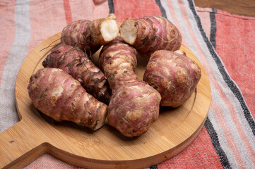 Group of fresh uncooked topinambur or Jerusalem artichoke roots