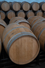 Rows of french and american oak barrels in cellars of winery in Rioja wine making region, Spain